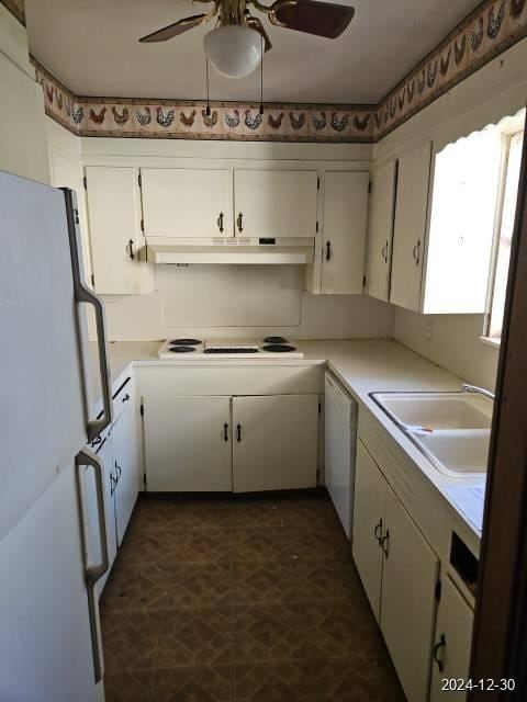 kitchen with ceiling fan, sink, white cabinets, and white appliances