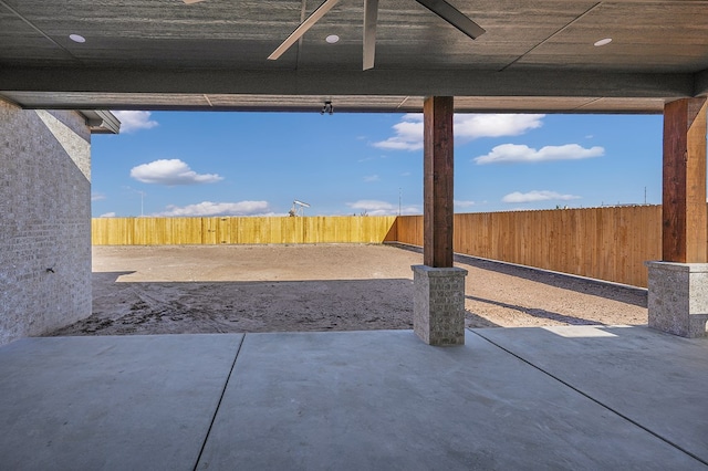 view of patio featuring ceiling fan