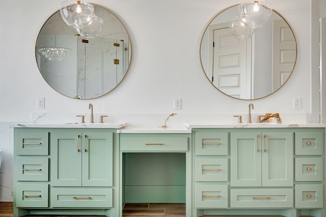 bathroom featuring hardwood / wood-style flooring, vanity, and a shower with door