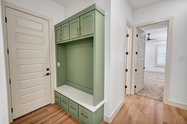 mudroom with light hardwood / wood-style flooring