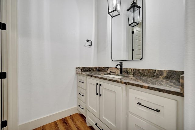 bathroom featuring hardwood / wood-style flooring and vanity