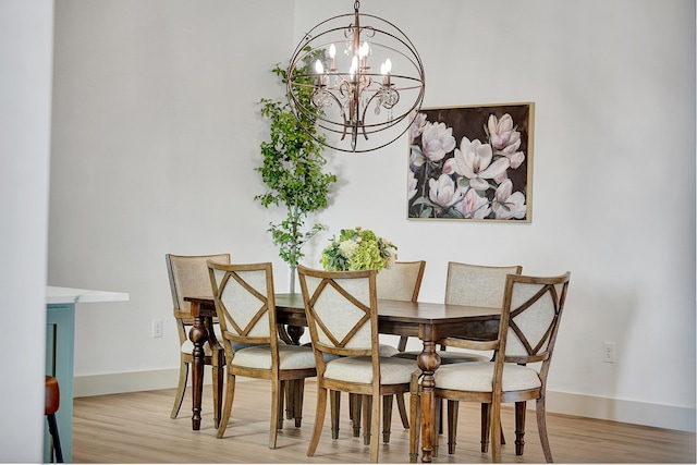 dining room featuring a chandelier and light hardwood / wood-style floors