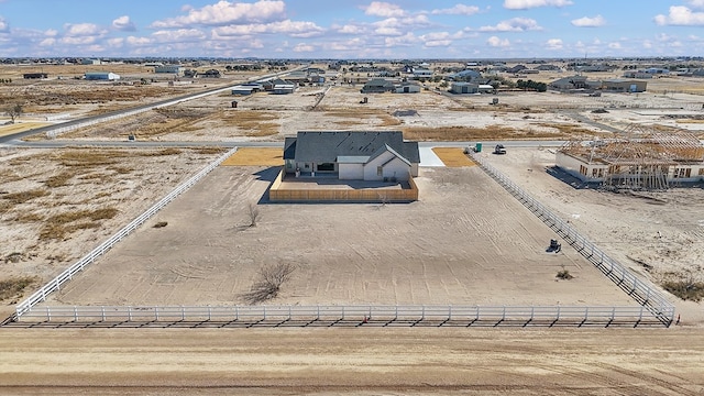 birds eye view of property with a rural view