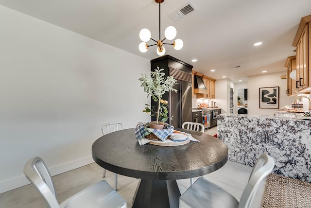 909 Pine Ct, Midland, TX 79705 - dining room featuring a chandelier and recessed lighting