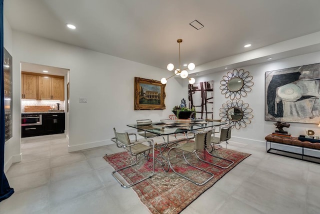 909 Pine Ct, Midland, TX 79705 - dining space with recessed lighting and a chandelier
