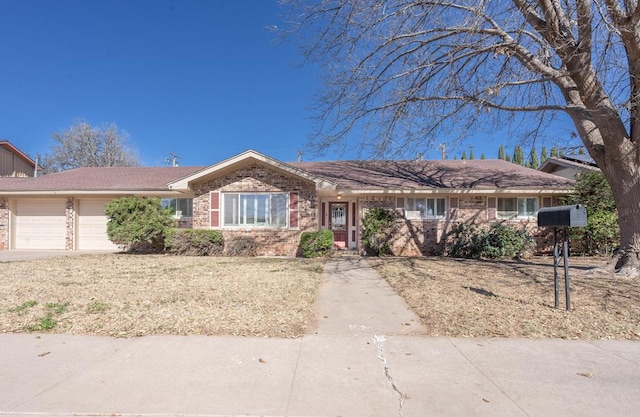 ranch-style house featuring a garage