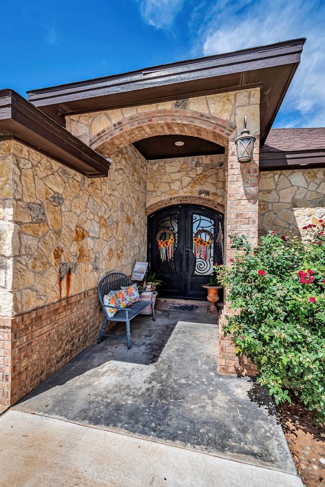 1210 S County Rd 1117, Midland, TX 79706 - property entrance featuring stone siding and french doors