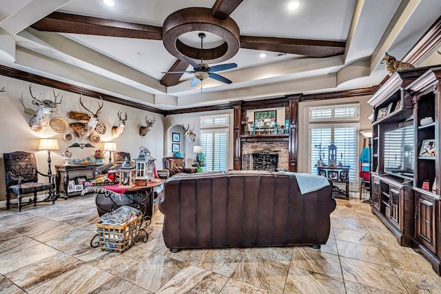 1210 S County Rd 1117, Midland, TX 79706 - living area with ceiling fan, plenty of natural light, a stone fireplace, and a raised ceiling