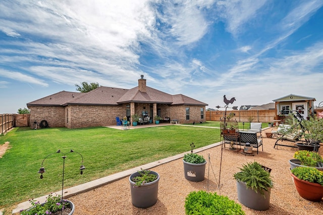 1210 S County Rd 1117, Midland, TX 79706 - back of property featuring a patio area and a chimney