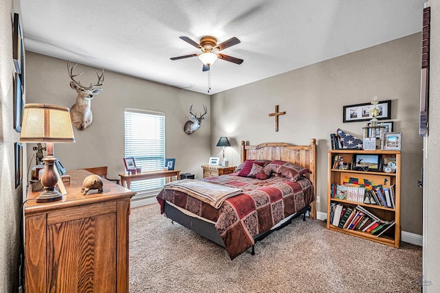 1210 S County Rd 1117, Midland, TX 79706 - bedroom with carpet floors, baseboards, and ceiling fan