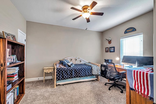 1210 S County Rd 1117, Midland, TX 79706 - carpeted bedroom with an office area, ceiling fan, and baseboards