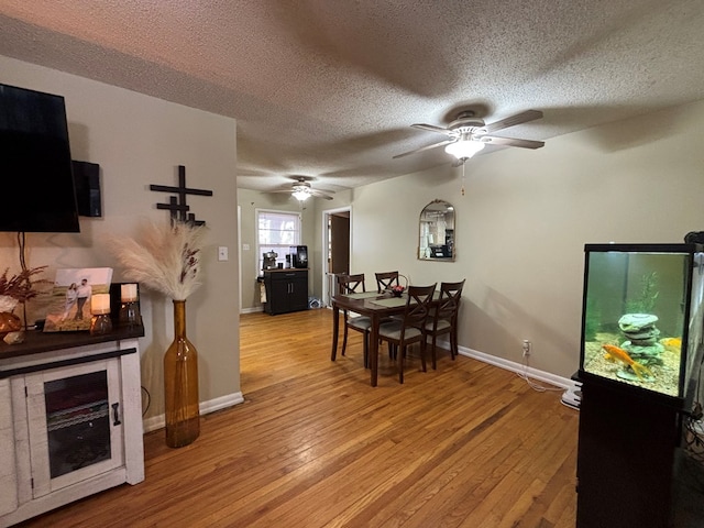 1806 38th St, Snyder, TX 79549 - dining space with a textured ceiling, a ceiling fan, light wood finished floors, and baseboards