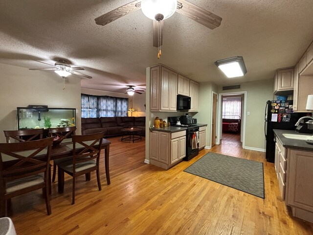 1806 38th St, Snyder, TX 79549 - kitchen with black appliances, a ceiling fan, dark countertops, a textured ceiling, and light wood-type flooring