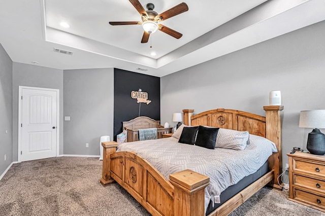 1321 Pine Ave, Midland, TX 79705 - bedroom with light carpet, a raised ceiling, a ceiling fan, and recessed lighting