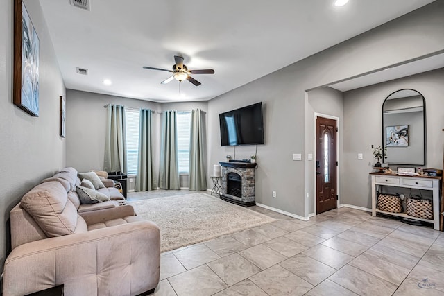 1321 Pine Ave, Midland, TX 79705 - living room with ceiling fan, a stone fireplace, and recessed lighting