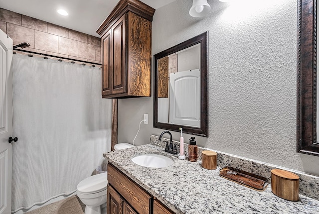 1321 Pine Ave, Midland, TX 79705 - bathroom featuring vanity, a shower with curtain, and a textured wall