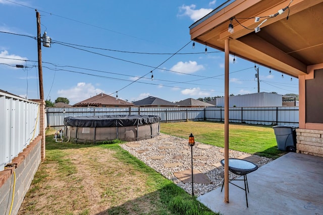 1321 Pine Ave, Midland, TX 79705 - fenced backyard with a patio area