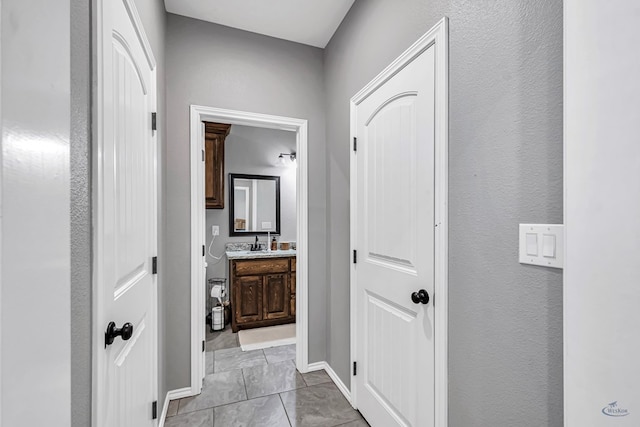 1321 Pine Ave, Midland, TX 79705 - hall with a sink and a textured wall