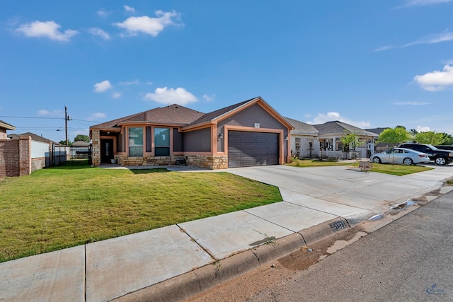 1321 Pine Ave, Midland, TX 79705 - view of front of home with stone siding, concrete driveway, an attached garage, stucco siding, and roof with shingles