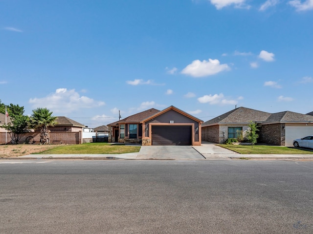 1321 Pine Ave, Midland, TX 79705 - single story home featuring an attached garage, driveway, and stone siding