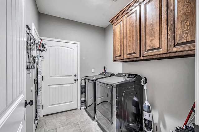 1321 Pine Ave, Midland, TX 79705 - washroom with cabinet space and washer and clothes dryer