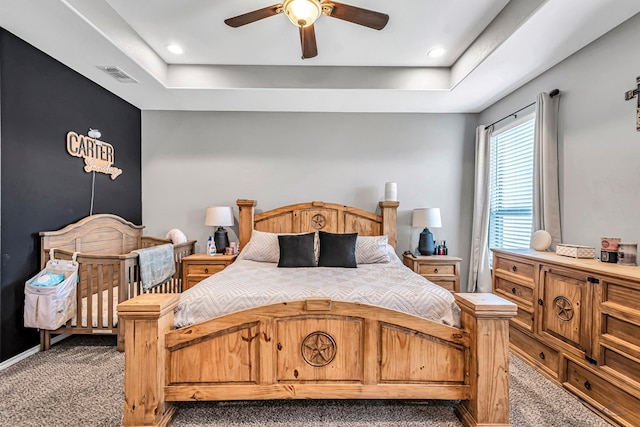 1321 Pine Ave, Midland, TX 79705 - carpeted bedroom featuring a raised ceiling, a ceiling fan, and recessed lighting