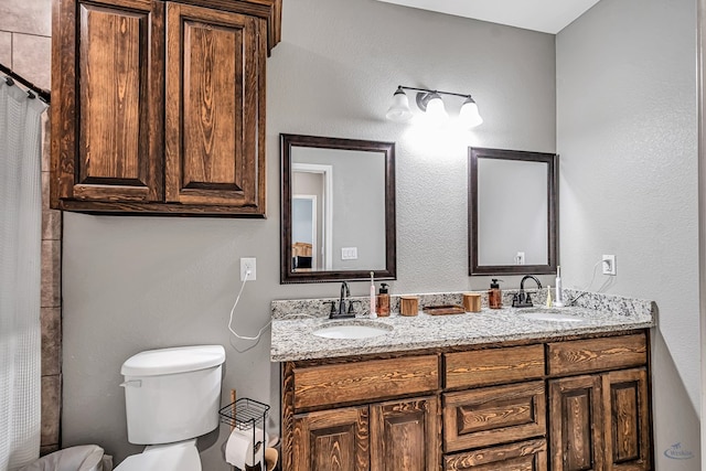 1321 Pine Ave, Midland, TX 79705 - bathroom featuring double vanity and curtained shower
