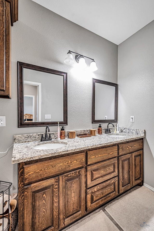 1321 Pine Ave, Midland, TX 79705 - full bath featuring double vanity and baseboards