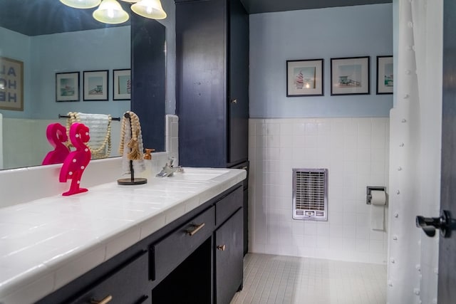 bathroom with vanity and heating unit