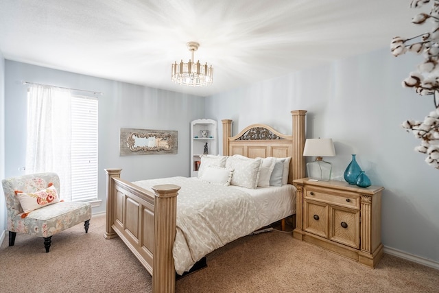 bedroom featuring a chandelier and light colored carpet