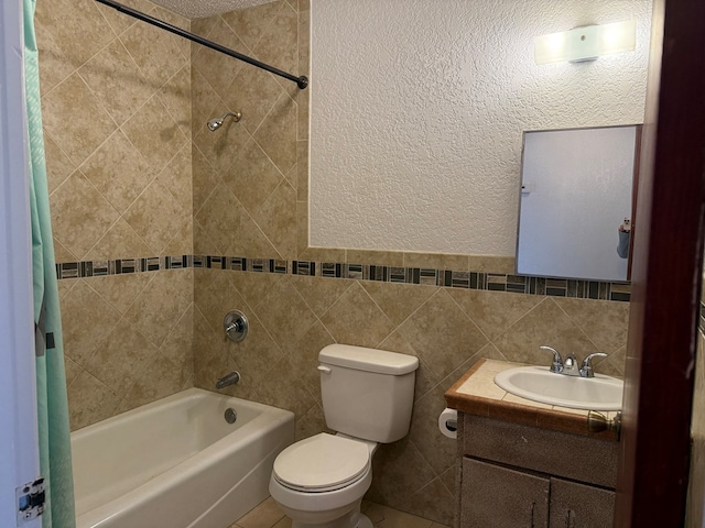 full bathroom with toilet, tasteful backsplash, tile walls, vanity, and shower / bath combo