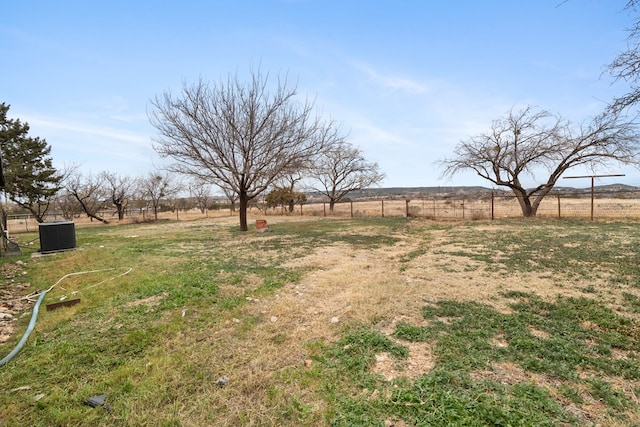 view of yard with a rural view