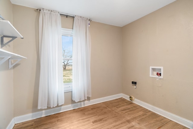 laundry area with washer hookup and plenty of natural light