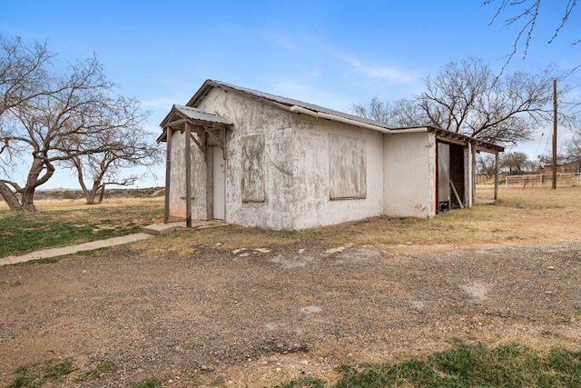 view of outdoor structure featuring a rural view