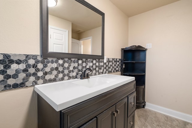 bathroom featuring tasteful backsplash and vanity