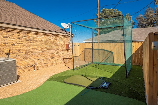 view of patio / terrace featuring central AC unit and a fenced backyard