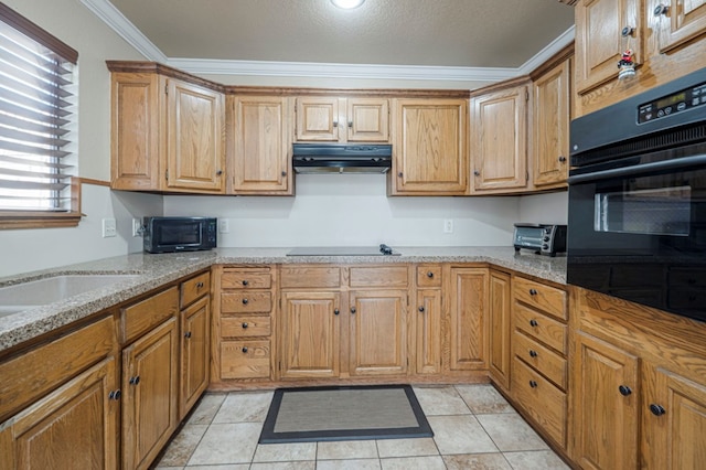 kitchen with crown molding, light tile patterned floors, light stone countertops, under cabinet range hood, and black appliances