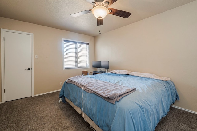 carpeted bedroom with ceiling fan, a textured ceiling, and baseboards