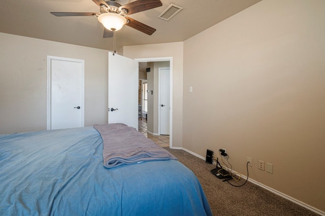 bedroom with baseboards, visible vents, ceiling fan, and carpet flooring