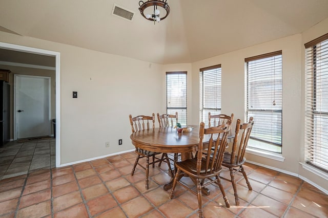 dining area featuring visible vents, baseboards, and tile patterned floors