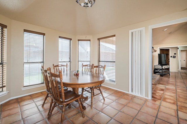 dining area featuring baseboards and light tile patterned floors