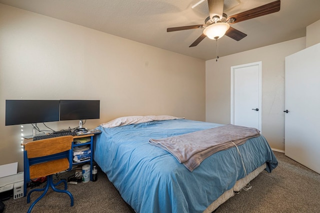 bedroom featuring a ceiling fan and carpet