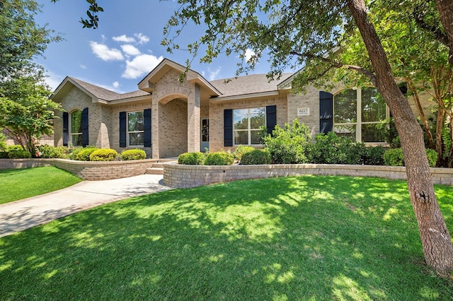 6113 Turtle Creek Rd, Midland, TX 79707 - ranch-style home with brick siding and a front lawn