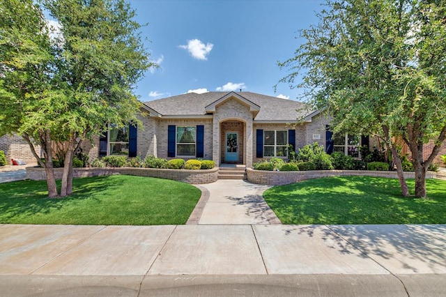 6113 Turtle Creek Rd, Midland, TX 79707 - single story home featuring brick siding and a front yard