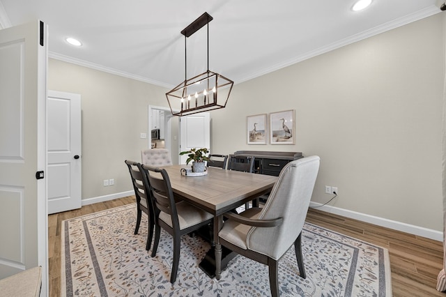 6113 Turtle Creek Rd, Midland, TX 79707 - dining space with crown molding, light wood-style floors, recessed lighting, and a chandelier