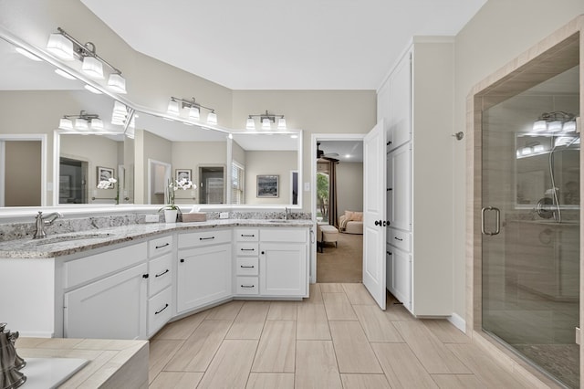 6113 Turtle Creek Rd, Midland, TX 79707 - bathroom with double vanity and a shower stall