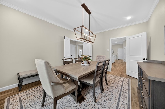 6113 Turtle Creek Rd, Midland, TX 79707 - dining room with crown molding, light wood finished floors, a chandelier, and recessed lighting