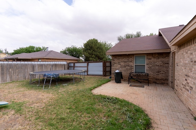 10905 E County Rd 107, Midland, TX 79706 - view of yard with a trampoline and a patio area