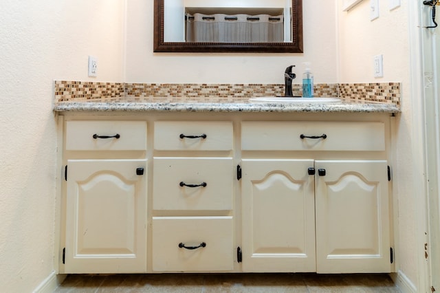 10905 E County Rd 107, Midland, TX 79706 - detailed view of a sink, baseboards, and backsplash