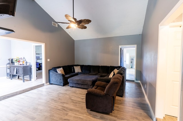 10905 E County Rd 107, Midland, TX 79706 - living room with ceiling fan, light wood-type flooring, high vaulted ceiling, and baseboards